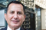 George Frazis, CEO of Westpac's consumer banking, wears one of the bank's new tech wristbands which can be used to 'tap ...