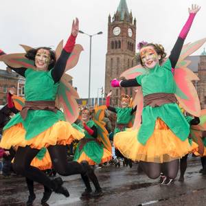 Dancers from St. Cecilia's College leap in the air as they make their way past the Guildhall during Derry City and Strabane District Council’s the annual Spring Carnival on St. Patrick’s Day in Derry-Londonderry. Picture Martin McKeown. Inpresspics.com. 17.03.17