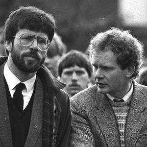 President of Sinn Fein Gerry Adams and Martin McGuinness at the funeral of Patrick Kelly . 1987