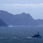 An Irish Naval ship and specialist boats near to Blacksod Lighthouse, Co. Mayo, Ireland, as the search continues for an Irish Coast Guard helicopter which went missing off the west coast of Ireland. PA