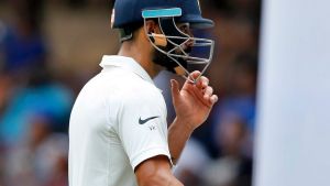 India's captain Virat Kohli leaves the ground after losing his wicket during the first day of their second test cricket ...
