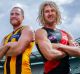 MELBOURNE, AUSTRALIA - MARCH 21: Hawthorn captain Jarryd Roughead (L) and Essendon captain Dyson Heppell pose for a ...