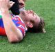 Down: Brendan Elliot of the Knights is treated by Tony Ayoub after being felled during Newcastle's clash with South ...