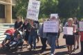 Parents protesting about convicted child sex offenders being allowed to return to school. 