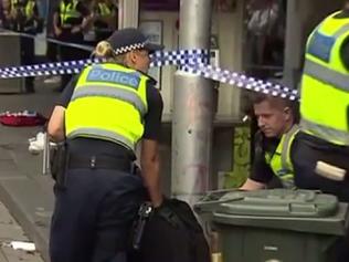 Stills from 7News of a stabbing in Elizabeth st Melbourne 22/3/17