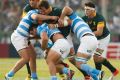 Primed: Agustin Creevy fights for the ball with Lodewyk De Jager at the Estadio Padre Ernesto Martearena Stadium in ...