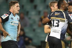 SYDNEY, AUSTRALIA - MARCH 18: Michael Hooper of the Waratahs looks dejected as Henry Speight of the Brumbies celebrates ...