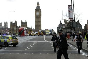 Police secure the area on the south side of Westminster Bridge close to the Houses of Parliament in London, Wednesday, March 22, 2017.