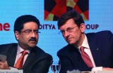 Aditya Birla Group chairman Kumar Mangalam Birla with Vodafone Group CEO Vittorio Colao on Monday.  The new company will ...