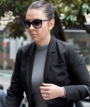 SYDNEY, AUSTRALIA - MARCH 24: Melissa Jade Higgins enters the Downing Centre Courts to face charges of fraud. It is ...