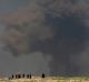 A large cloud of smoke rises during fighting between Iraqi security forces and Islamic State militants in early March.