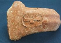 This ancient jar handle bears a royal stamp designating its contents for the king.