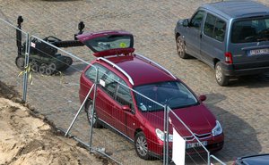 A police robot stands next to a car near the river in Antwerp, Belgium on Thursday, March 23, 2017.