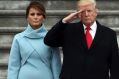 President Donald Trump with first lady Melania Trump and Major General Bradley Becker review troops in Washington.