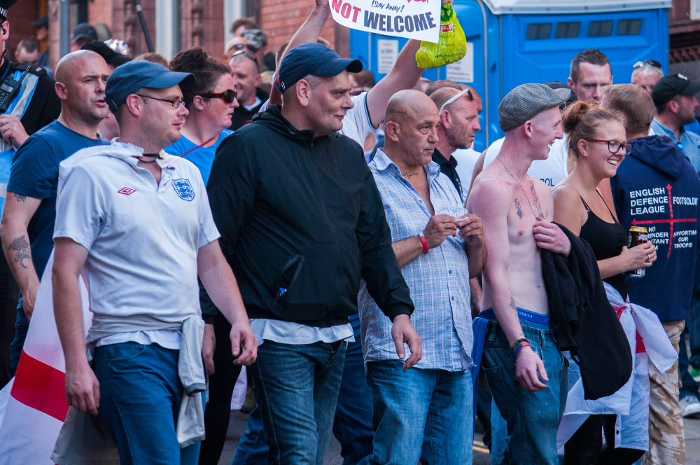 Centre, rolling cigarette: Conrad Ayscough, Halifax EDL