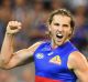 Marcus Bontempelli celebrates kicking a goal against the Magpies.