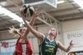 Dandenong's Aimie Clydesdale drives to the basket against Perth's Carley Mijovic. 