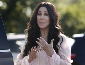 Singer and actress Cher stops to talk to media as she leaves a fundraiser for Democratic presidential candidate Hillary Clinton at the Pilgrim Monument and Provincetown Museum in Provincetown, Mass., Sunday, Aug. 21, 2016. (AP Photo/Carolyn Kaster)