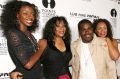 Joni Sledge, one of the original members of "Sister Sledge," second from left, with music producer Rodney Jerkins, her ...