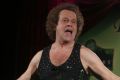 Richard Simmons speaks to the audience before the start of a summer salad fashion show at Grand Central Terminal in New ...