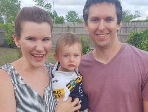 Linda and Adam Neilly with their son Lincoln wait for Cyclone Debbie.