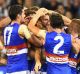 Travis Cloke is congratulated by teammates after his goal.