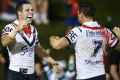 Centre of the action: Gordon celebrates his late try with Mitchell Pearce.