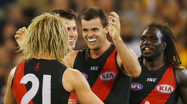 Brent Stanton and Dyson Heppell celebrate a goal against the Hawks at the MCG on Saturday night.