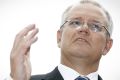 Treasurer Scott Morrison talks to the media at Parliament House on Friday.