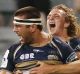 CANBERRA, AUSTRALIA - MARCH 25: Chris Alcock of the Brumbies celebrates scoring a try with team mate Joe Powell of the ...