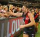 Big night: Jobe Watson of the Bombers celebrates the win with fans at the MCG on Saturday night.