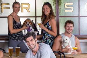 Vaucluse trainer Mike Webster (front centre) with Bobby the shelter dog. The Strut with Mutts is a chance for the dogs ...