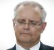 Treasurer Scott Morrison addresses the media during a doostop interview at Parliament House in Canberra on Friday 24 ...