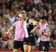 Nick Riewoldt of the Saints is helped onto the stretcher after hurting his knee.