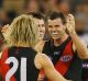 Brent Stanton and Dyson Heppell celebrate a goal against the Hawks at the MCG on Saturday night.
