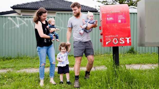 Holly and Liam Pender with 2-year-old Jemima and 7-month-old twins, Adeline and Esther.