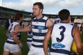 PERTH, AUSTRALIA - MARCH 26: Patrick Dangerfield of the Cats revs up his team mates while runningonto the field during ...
