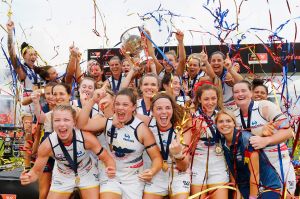 Crows players celebrate during the AFL Women's Grand Final between the Brisbane Lions and the Adelaide Crows on March ...