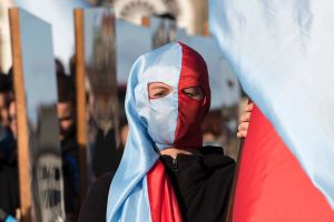 Participants of a so-called 'Mirror March' (Spiegelmarsch) art performance carry flags and giant mirrors in Dresden, ...