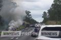 A car burst into flames after a collision with a truck at Gunalda south of Maryborough.
