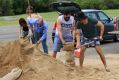 Huge piles of sand were dumped at Lou Lister Park for local residents to dig into with shovels and sandbags.