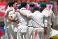 Key player: Australia's Pat Cummins (without cap) celebrates with teammates during the third Test in Ranchi.