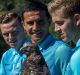 Socceroos (from left) Brad Smith, Tim Cahill, and Rylie McGree at Tarangoa Zoo with Nangaw the owl.