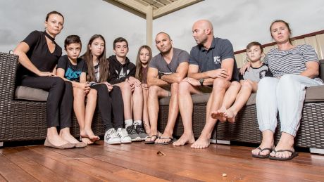 Brothers Craig and Cameron Zammit (pictured with their wives, Michelle and Belinda, and children) are taking up a fight ...