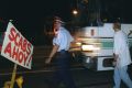 Police escorting non-union labour to Patrick Stevedores through the MUA picket lines in 1998. Today, strike action is low.