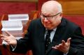 Attorney-General George Brandis introduced the legislation to change section 18C of the Racial Discrimination Act.