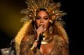In a display of regal brilliance, a heavily pregnant Beyonce performs at the Grammys.