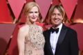 Nicole Kidman, wearing a feature red lip, and Keith Urban arrive at the Oscars on Sunday, Feb. 26, 2017, at the Dolby ...