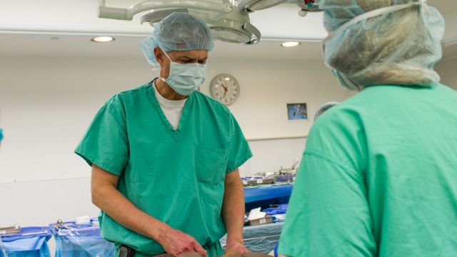 Neurosurgeon John Ruge examines Dominique before her surgery at Advocate Children's Hospital in Chicago. 