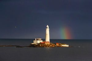 A rainbow appears next to St. Mary's Lighthouse, Whitley Bay, England, 